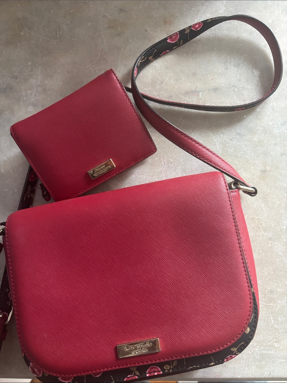 Kate Spade red crossbody bag with floral accents. Matching purse/wallet.
